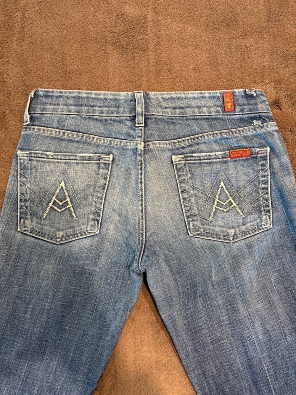 7 For All Mankind A Pocket Flare Jeans Size 27 Medium Wash Heavy Distressed Hem
